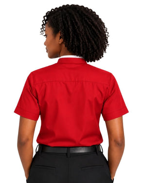 A woman shown from the back wearing a short-sleeve red clerical shirt tucked into black pants, against a plain white background.