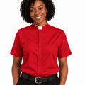 A woman wearing a red short-sleeve clerical shirt with a white collar, paired with black trousers and a black belt, shown against a plain white background.