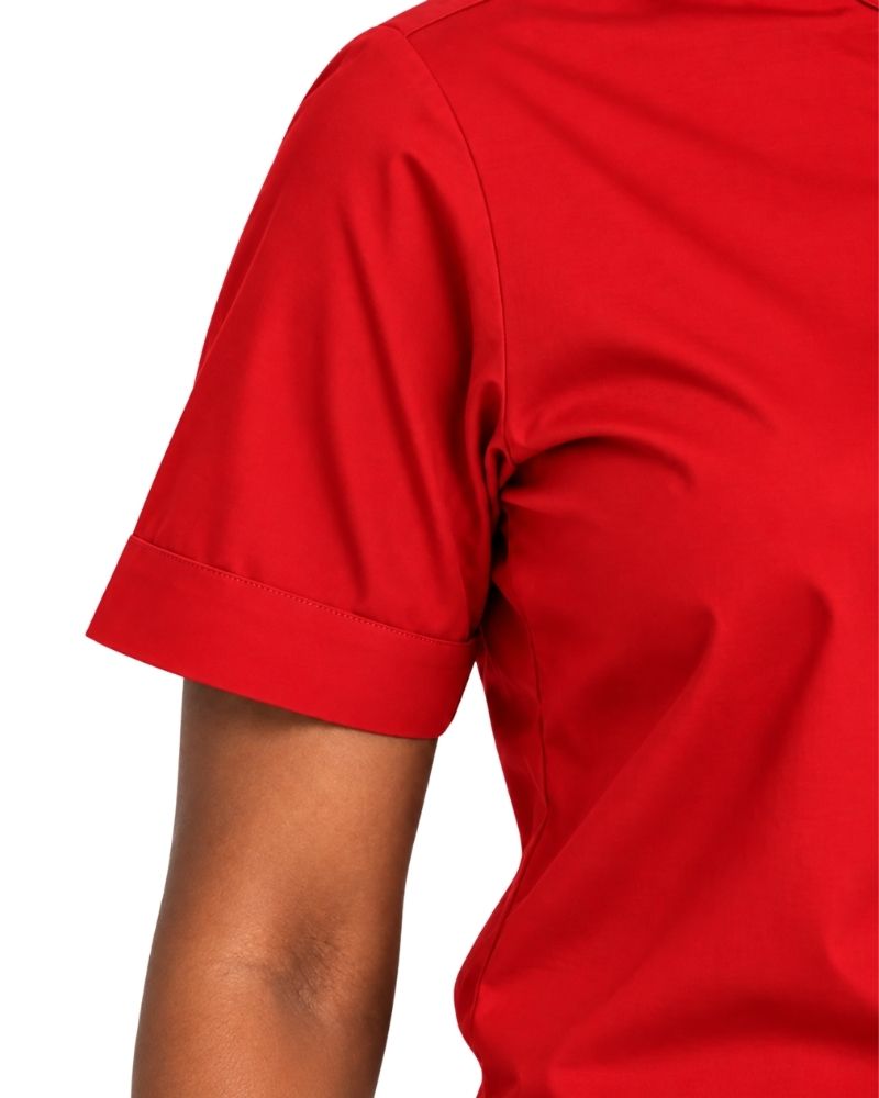 Close-up of a woman wearing a short-sleeve red clerical shirt, showing the sleeve cuff and side torso against a white background.