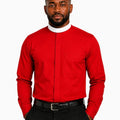 A man wearing a vibrant red long-sleeve clerical shirt with a contrasting white mock neck collar, paired with black trousers and a black belt, set against a plain white background.