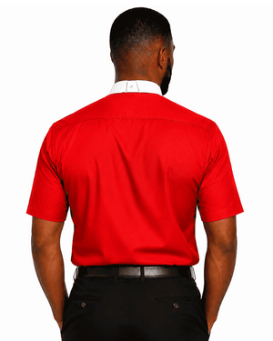 A man viewed from the back wearing a bright red short-sleeve clerical shirt with a white collar, paired with black trousers and a black belt, against a plain white background.