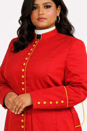 Woman wearing a red robe with gold buttons on a white background