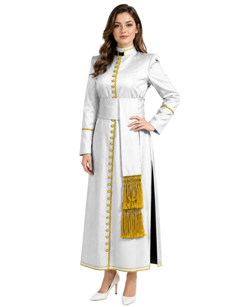 A woman modeling a long white cassock with gold trim, gold buttons, and a gold fringe panel, shown against a plain white background.