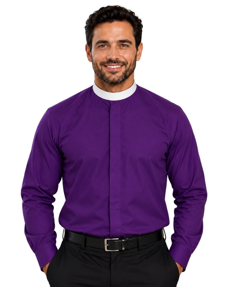 A smiling man wearing a long-sleeve purple clerical shirt with a white collar, paired with black trousers and a black belt, against a plain white background.