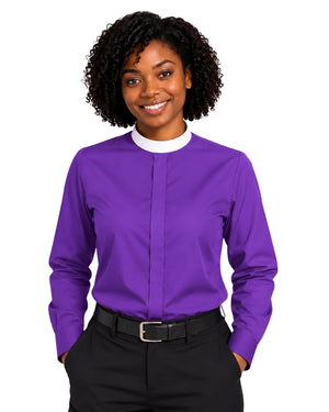 A woman with curly black hair wearing a vibrant purple long-sleeve clerical shirt with a contrasting white mock neck collar, paired with black trousers and a black belt, against a plain white background.
