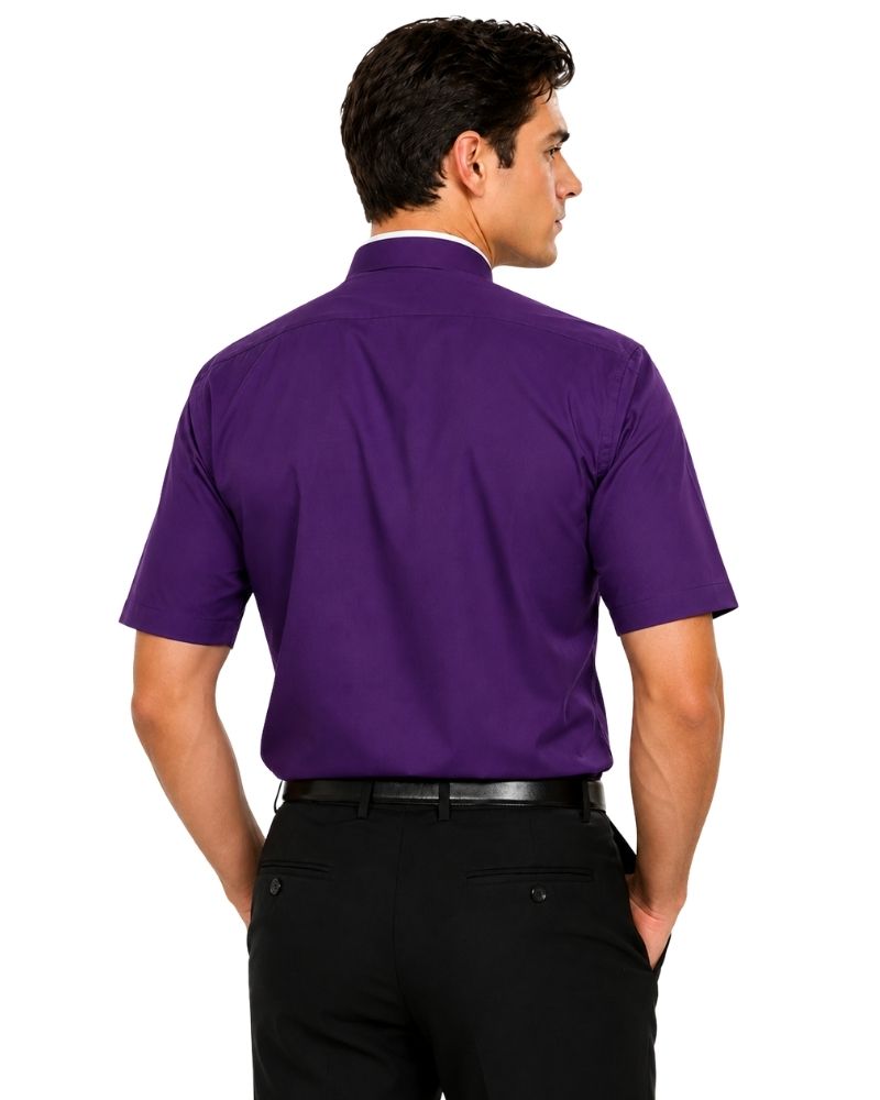 A man shown from the back wearing a short-sleeve purple clerical shirt tucked into black dress pants, against a plain white background.