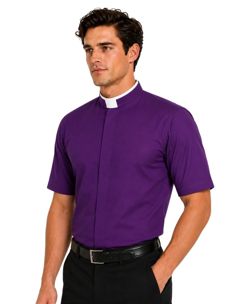 A man wearing a purple short-sleeve clerical shirt with a white collar, paired with black trousers and a black belt, photographed against a plain white background.