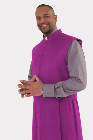 Man wearing a purple cassock over a gray shirt on a white background