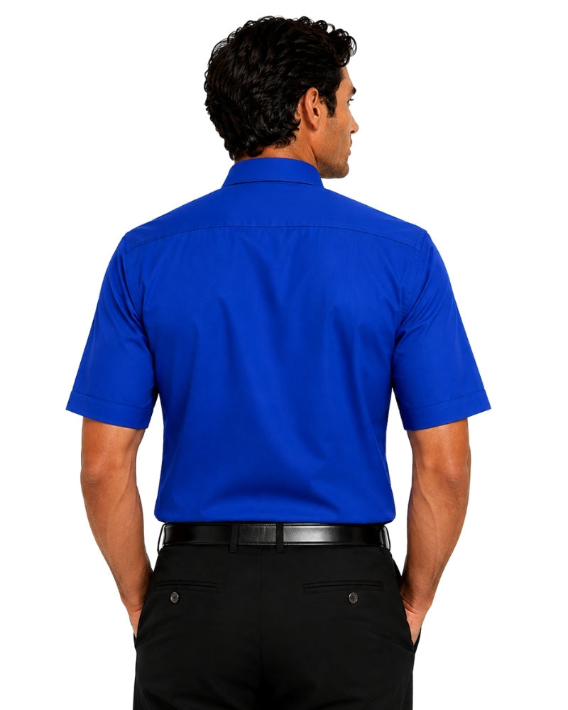 A man viewed from the back wearing a bright royal blue short-sleeve clerical shirt and black trousers against a plain white background.