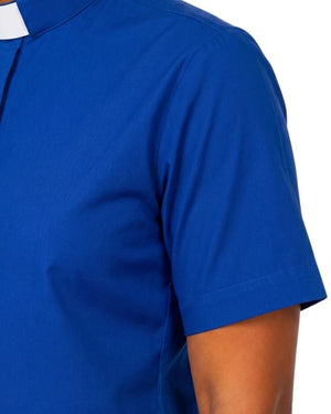 Close-up of a women wearing a royal blue short-sleeve clerical shirt, showing the chest, shoulder, and part of the arm against a plain white background.