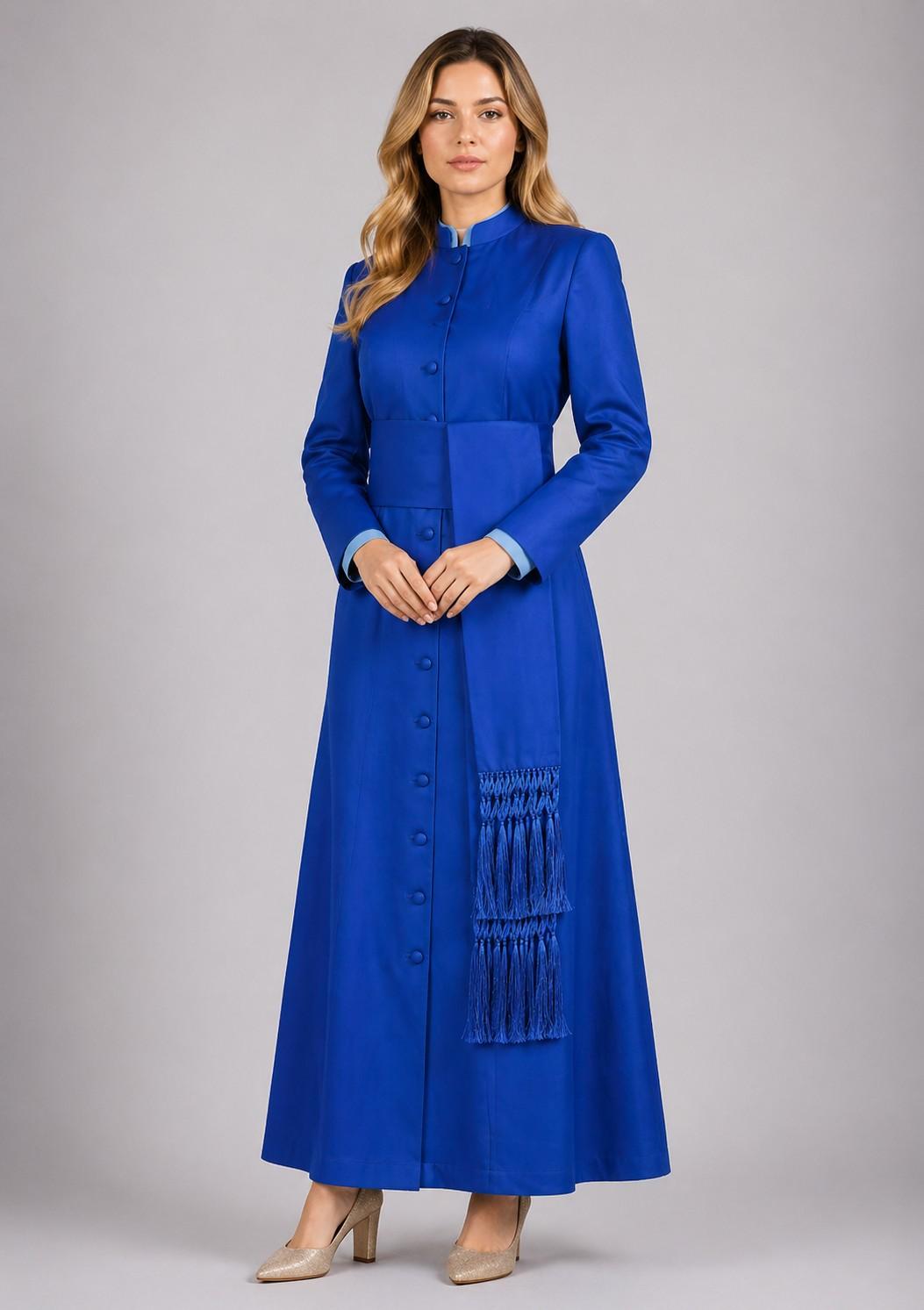 Woman wearing a long blue dress with a scarf on a gray background