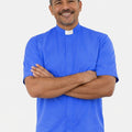 Man wearing a blue shirt with a white collar against a white background
