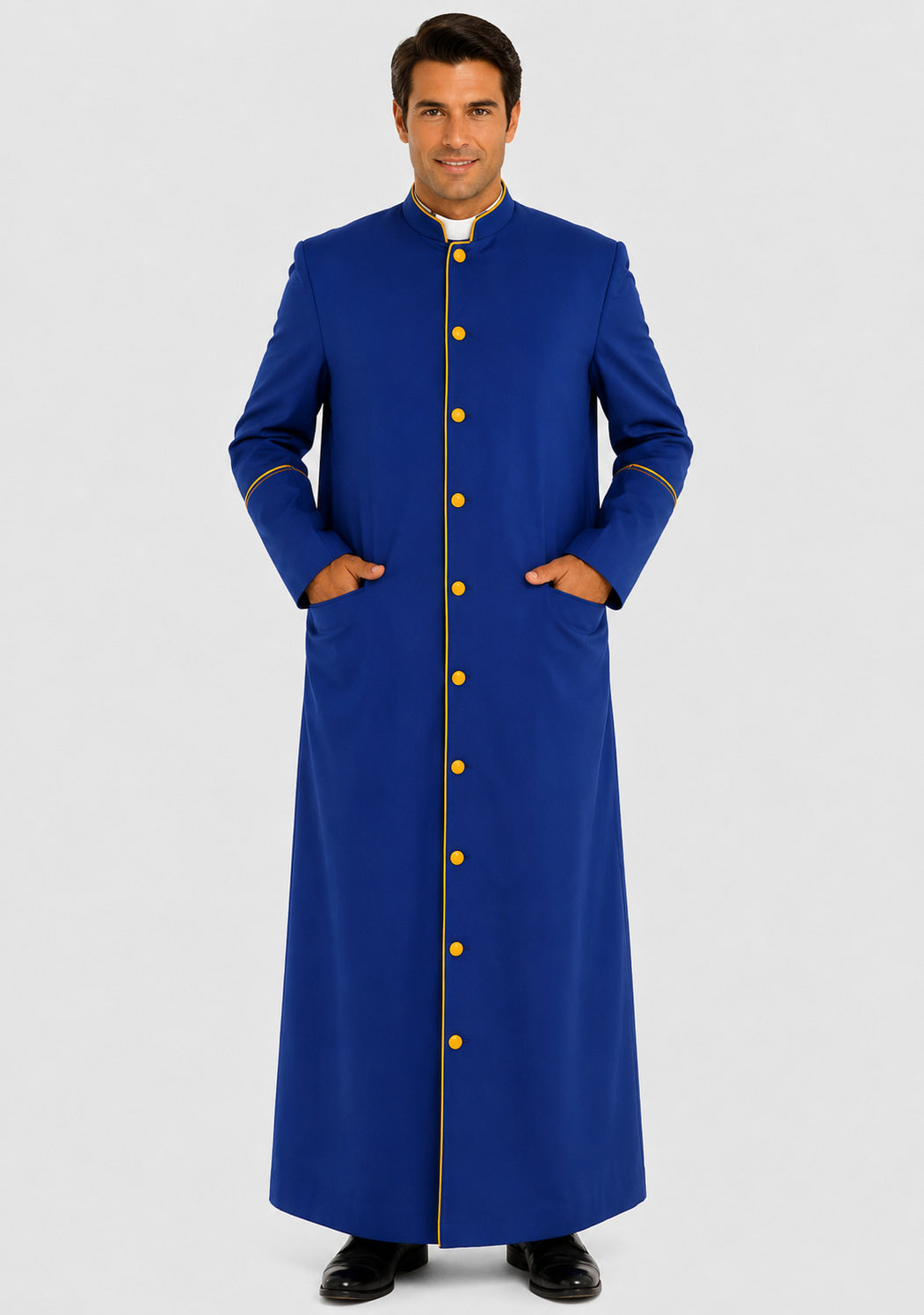Man wearing a long blue robe with gold buttons on a white background