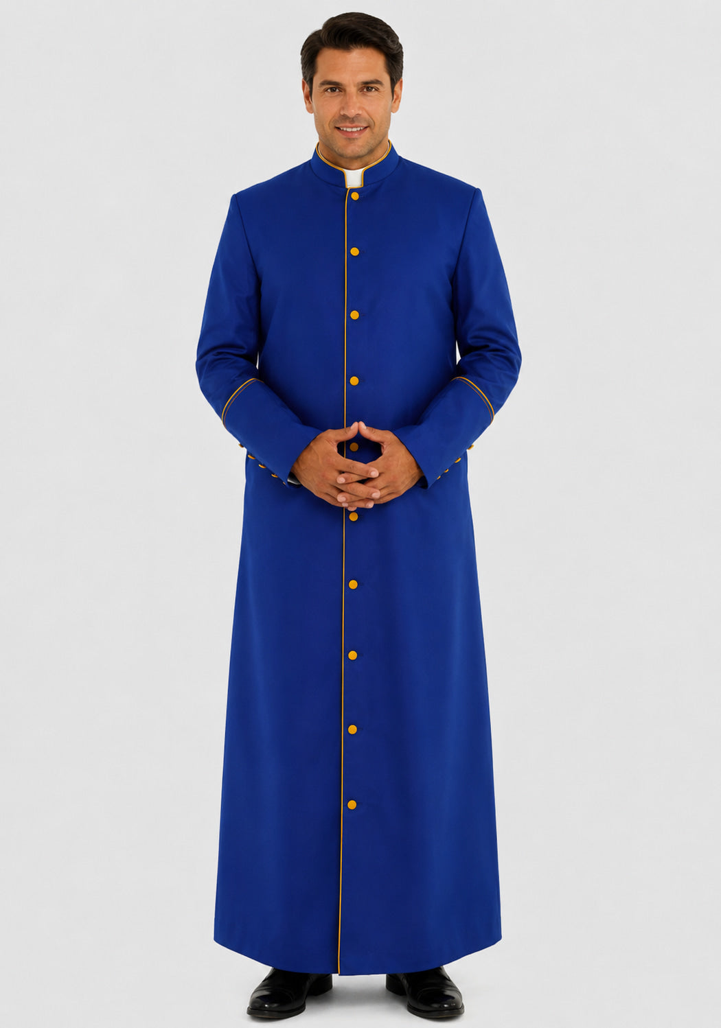 Man wearing a long blue robe with gold buttons on a white background
