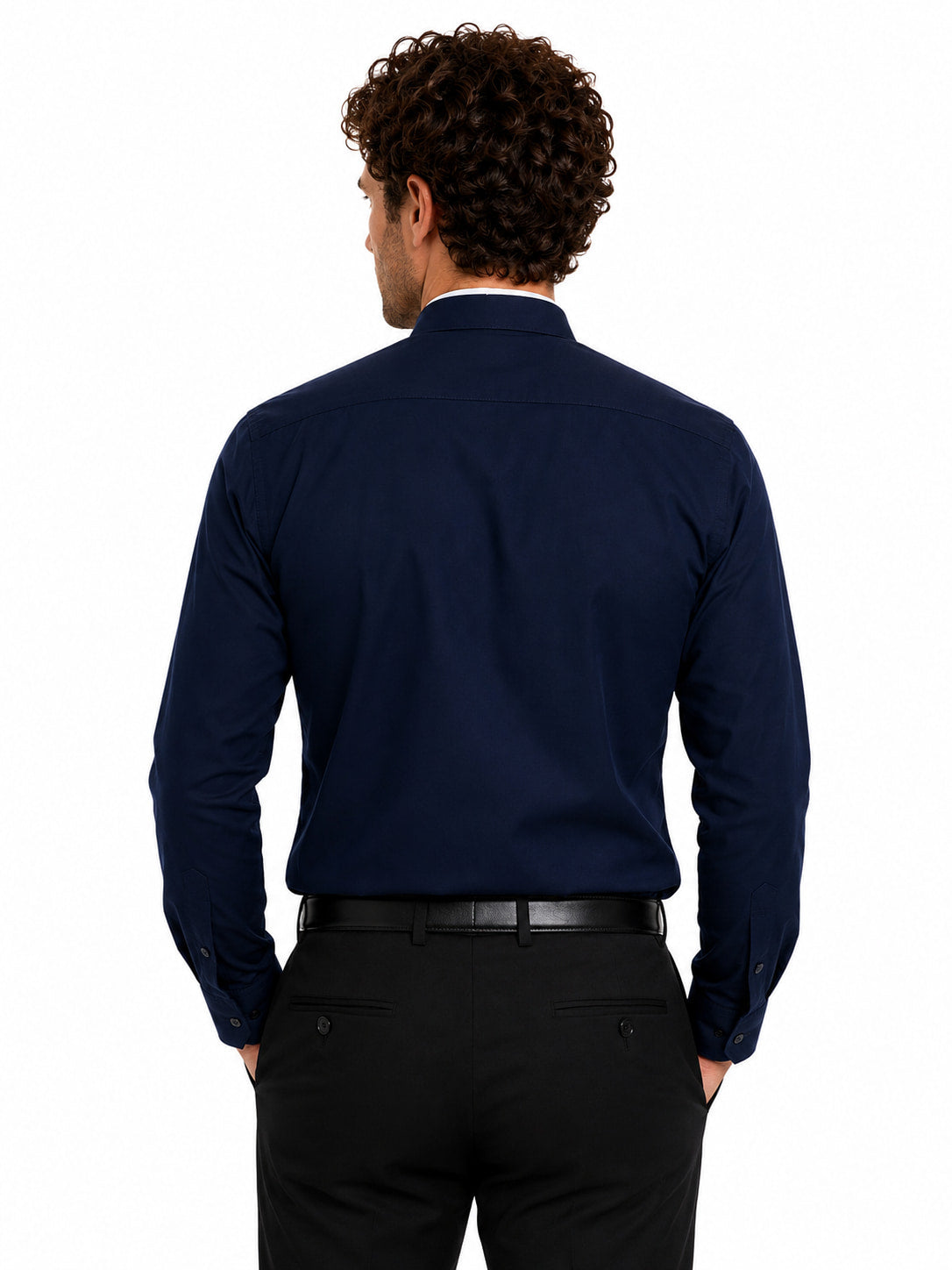 Man wearing a navy long-sleeve clerical shirt on a white background