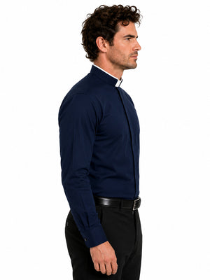 Man wearing a clerical navy blue shirt on a white background