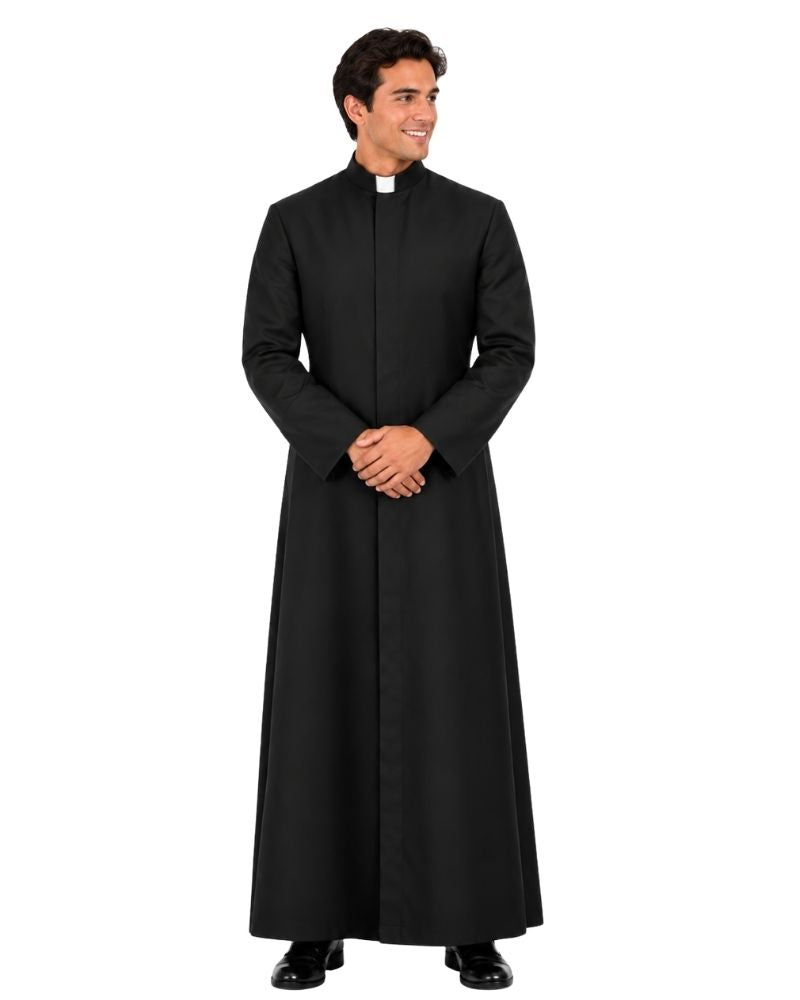 A man modeling a Sanctus Black Roman Robe with a high collar and a white clerical collar, standing against a plain white background.