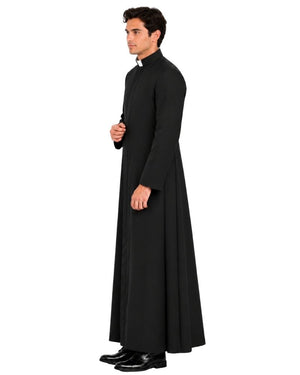 A man wearing a Sanctus Black Roman Robe with a high collar and black dress shoes, shown in profile against a plain white background.