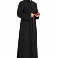 Man wearing a black priest's robe holding a book on a white background