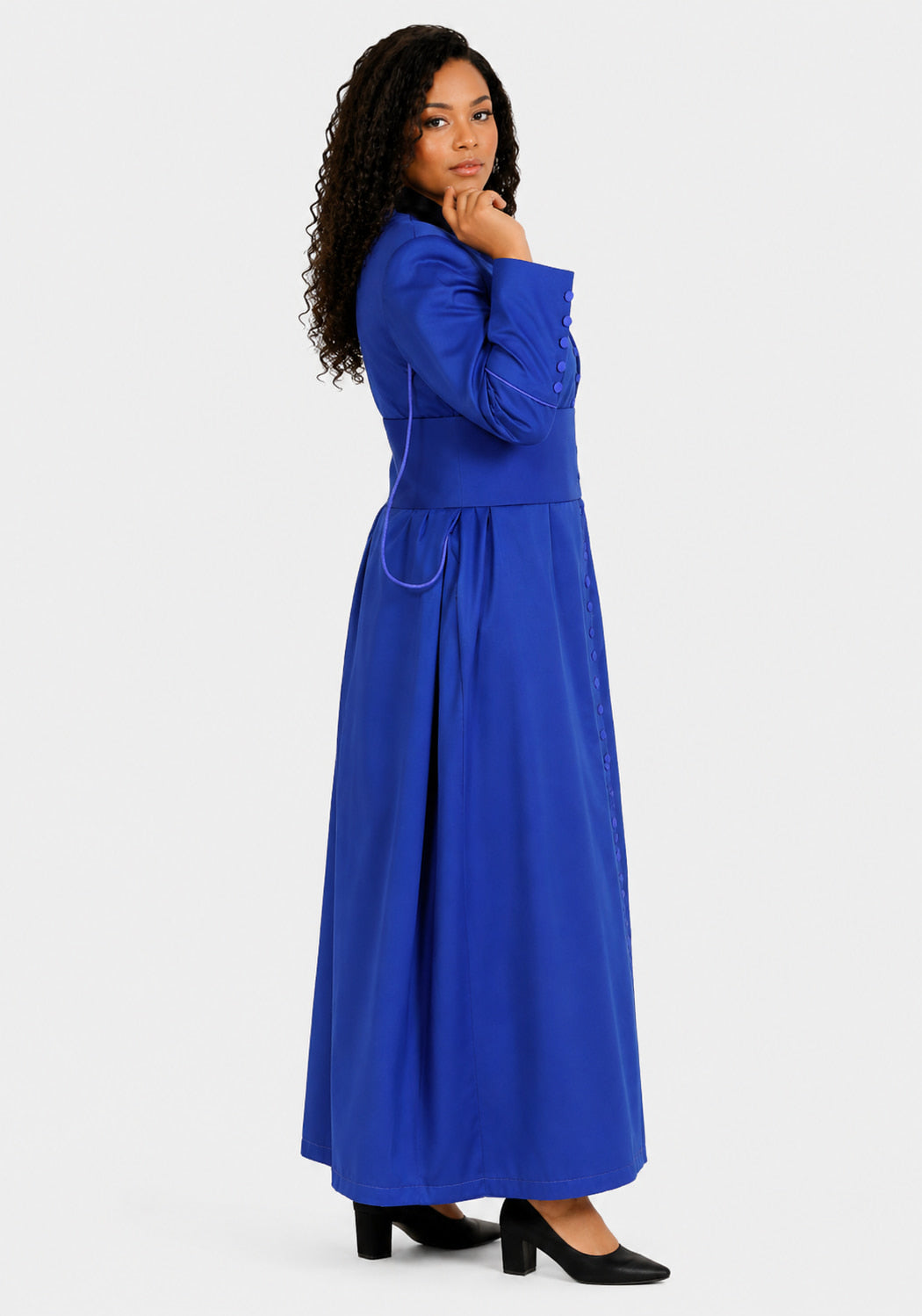 Woman wearing a blue robe against a white background