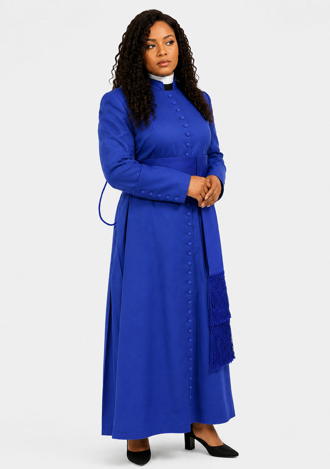 Woman wearing a blue robe with a matching shawl on a white background