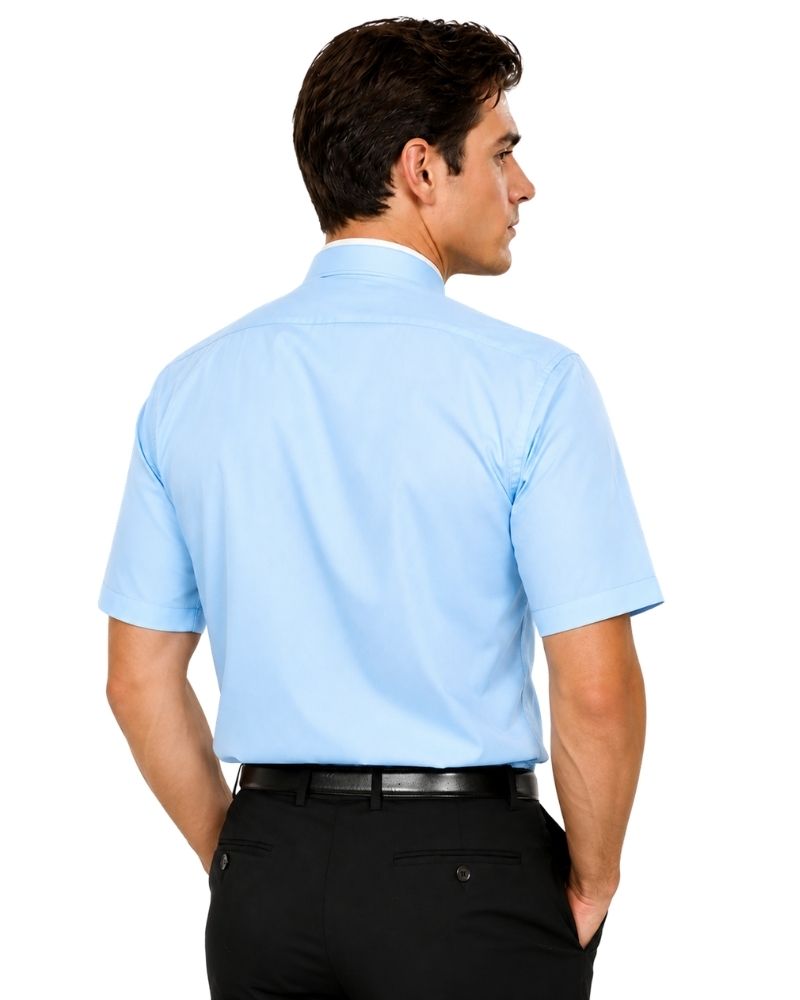 A man shown from the back wearing a light blue short-sleeve clerical shirt tucked into black trousers, against a plain white background.