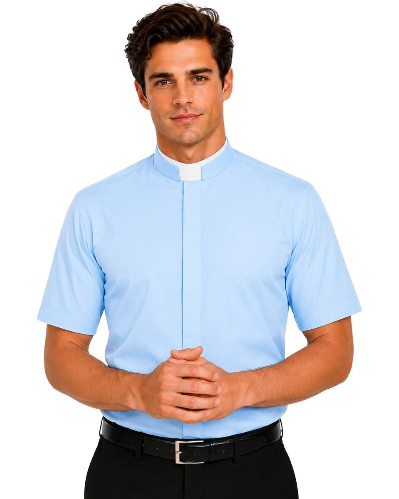 A man wearing a light blue short-sleeve clerical shirt with a white collar, paired with black trousers and a black belt, against a plain white background.