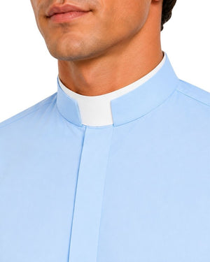 A close-up of a man wearing a light blue clerical shirt with a white collar, cropped from the lower face to the chest against a plain white background.