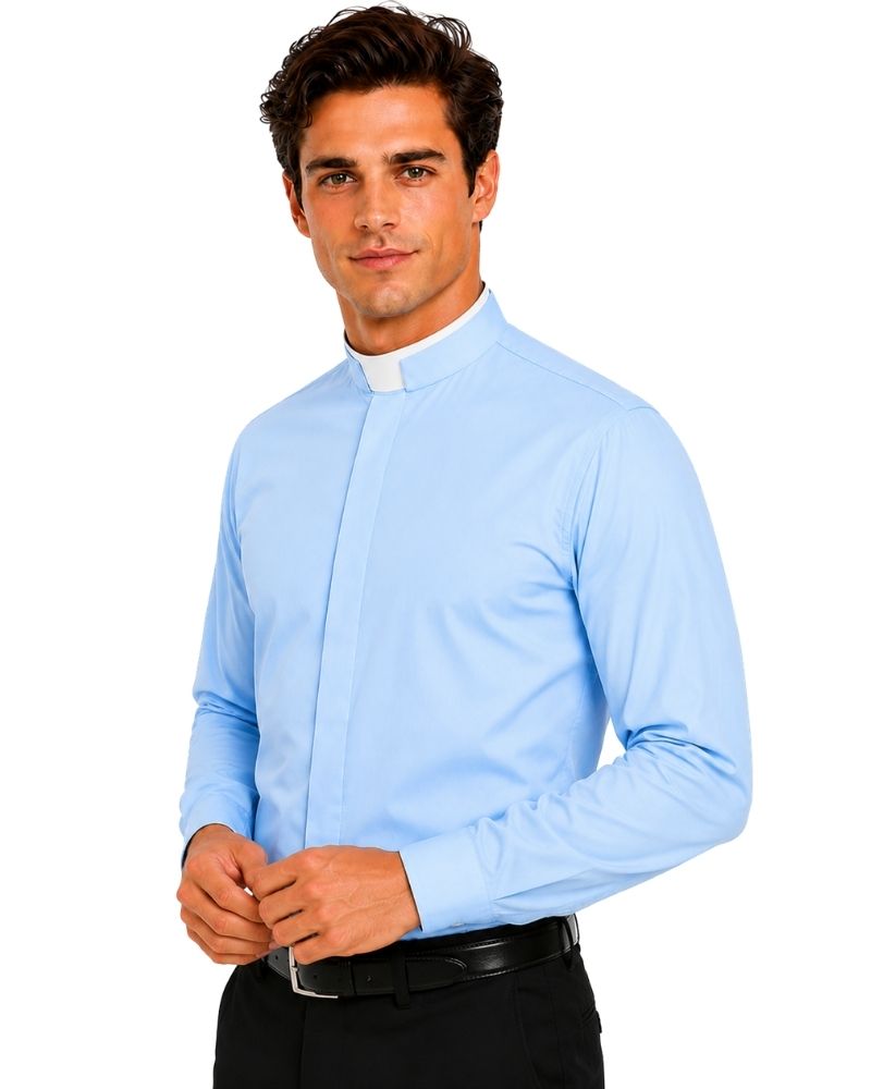 A man wearing a light blue long-sleeve clerical shirt with a white clerical collar, paired with black trousers and a black belt, against a plain white background.