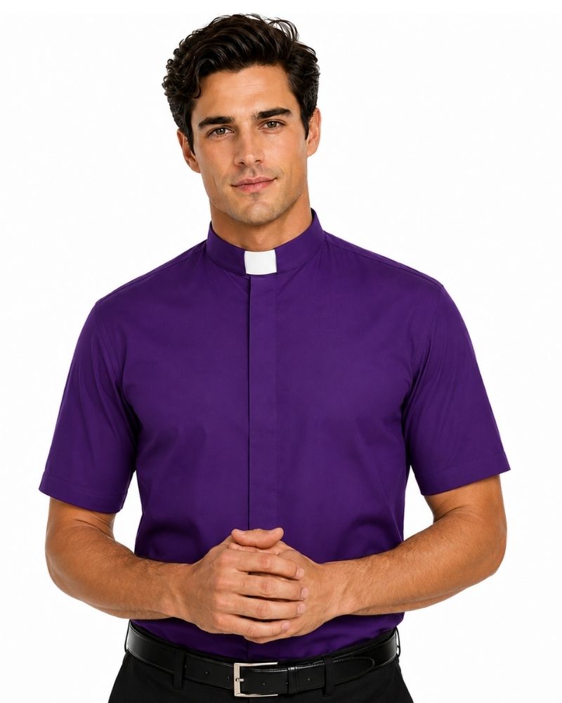 A man wearing a purple short-sleeve clerical shirt with a white collar tab, paired with a black belt and black pants, against a plain white background.