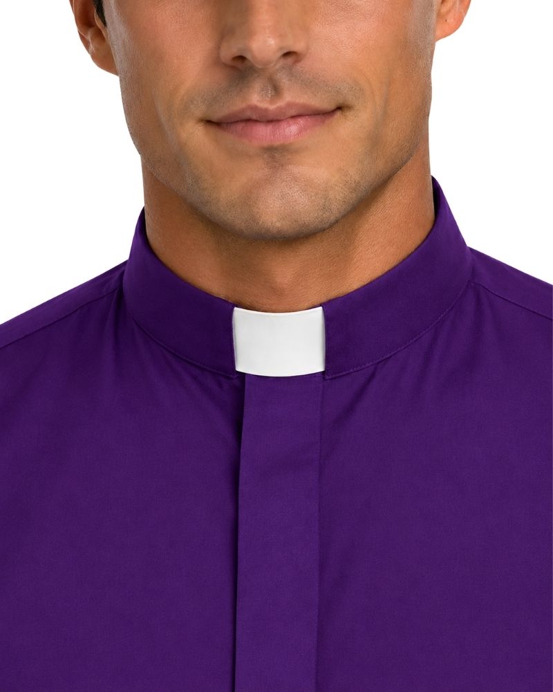 A close-up of a man wearing a purple clerical shirt with a white collar tab, shown from the lower face to the chest against a plain white background.