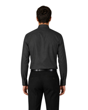 Man wearing a black clerical shirt with a white collar on a white background