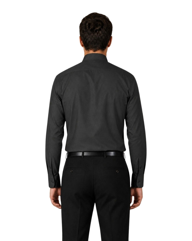 Man wearing a black clerical shirt with a white collar on a white background