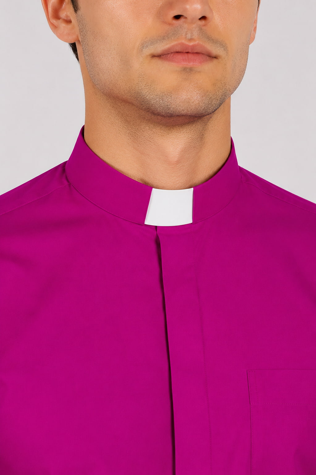 Purple clerical shirt with a white collar against a white background