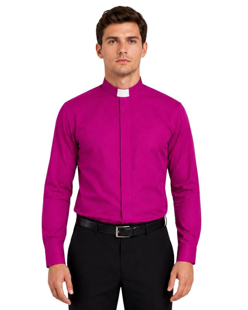 Man wearing a bright pink shirt and black pants on a white background