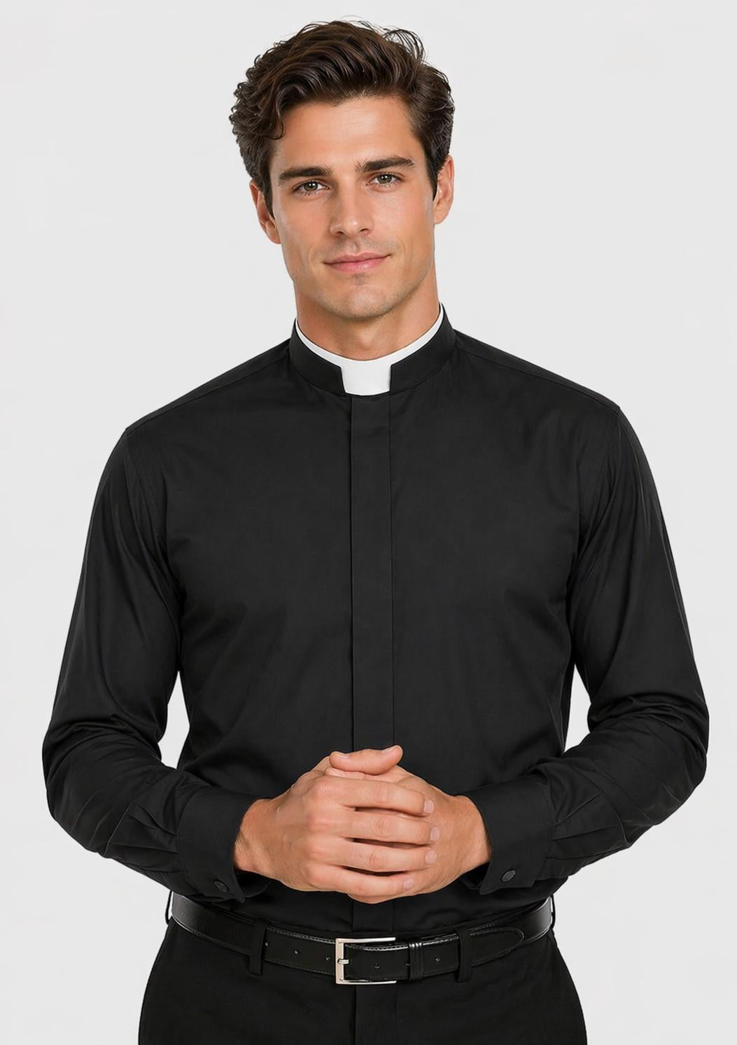 Man wearing a black clerical shirt with a white collar on a light gray background