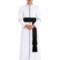 A man modeling White Clergy Cassock With Black Trim, a black waist sash, and black buttons, standing against a plain white background.