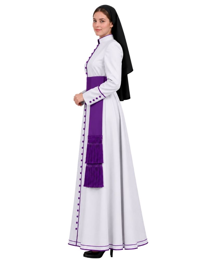 A woman modeling a White Clerical Cassock With Purple Trim, a purple waist sash, and a black veil, shown against a plain white background.