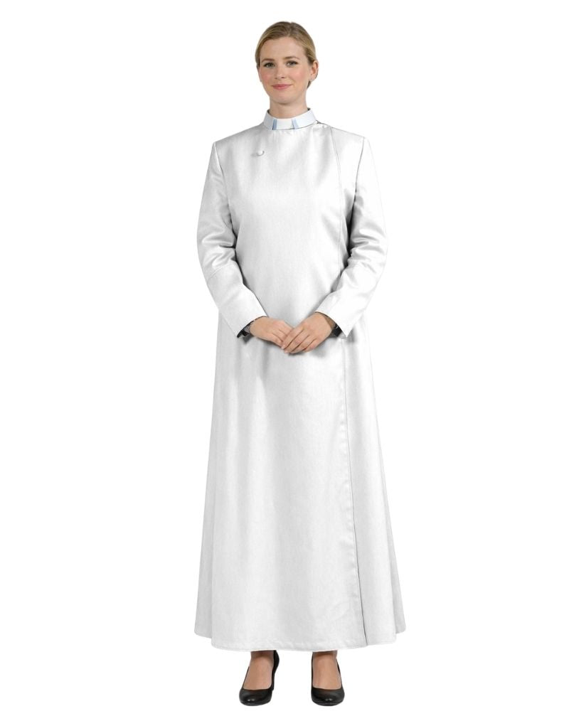A woman modeling a long white  robe with long sleeves and black shoes, photographed against a plain white background.