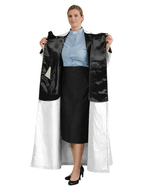 A woman modeling a black and white robe holding the open front panels to show the interior lining and full length. She is wearing a light blue collared shirt and a black skirt against a plain white background.