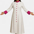 Woman wearing a long white robe with pink accents on a white background