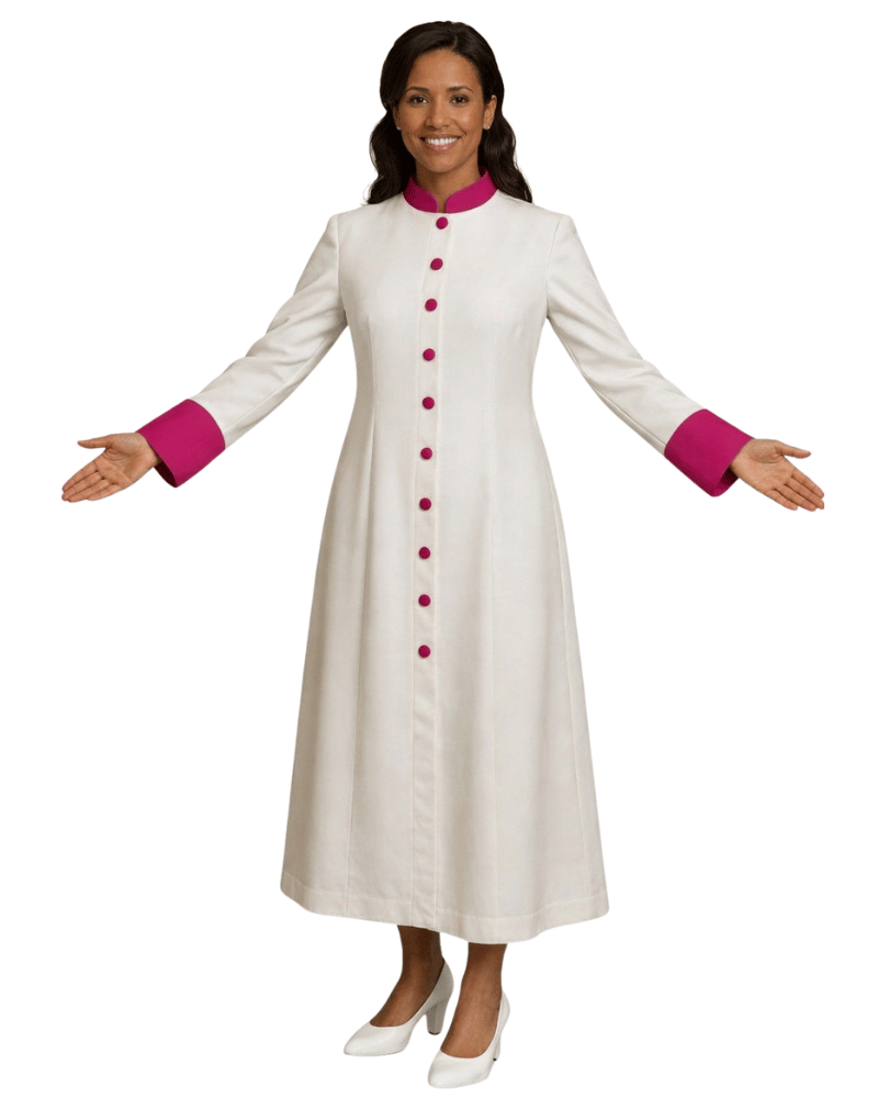 A woman modeling a long white cassock with bright pink trim at the collar, cuffs, and matching pink buttons down the front, shown against a plain white background.