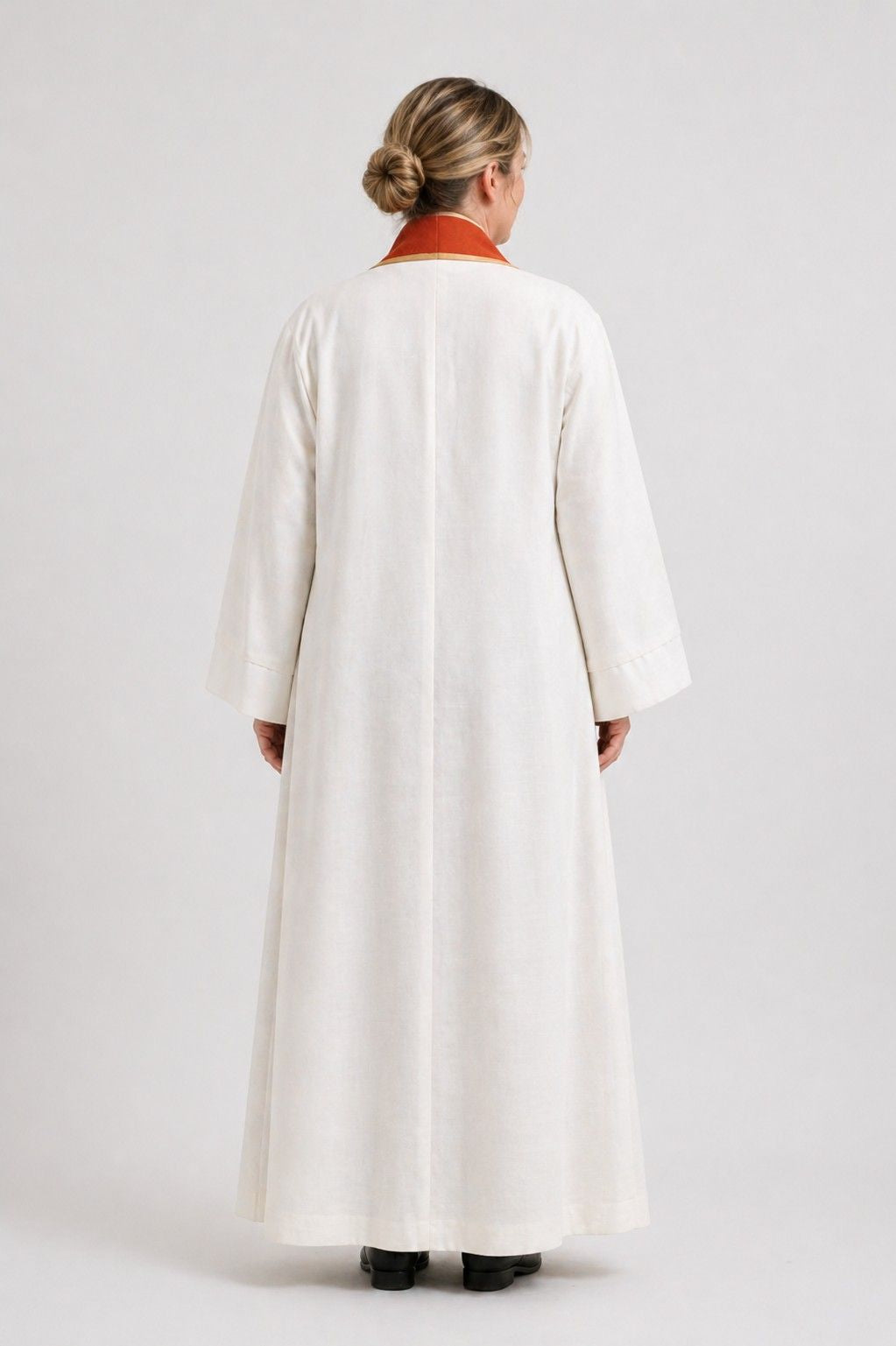 Women wearing a long white robe on a white background