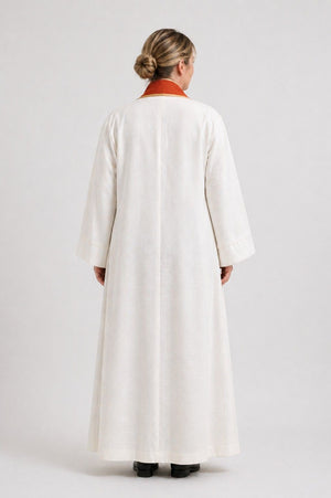 Women wearing a long white robe on a white background