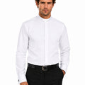 Man wearing a white clerical shirt and black pants on a white background