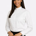 Woman wearing a white shirt with a tab collar on a white background