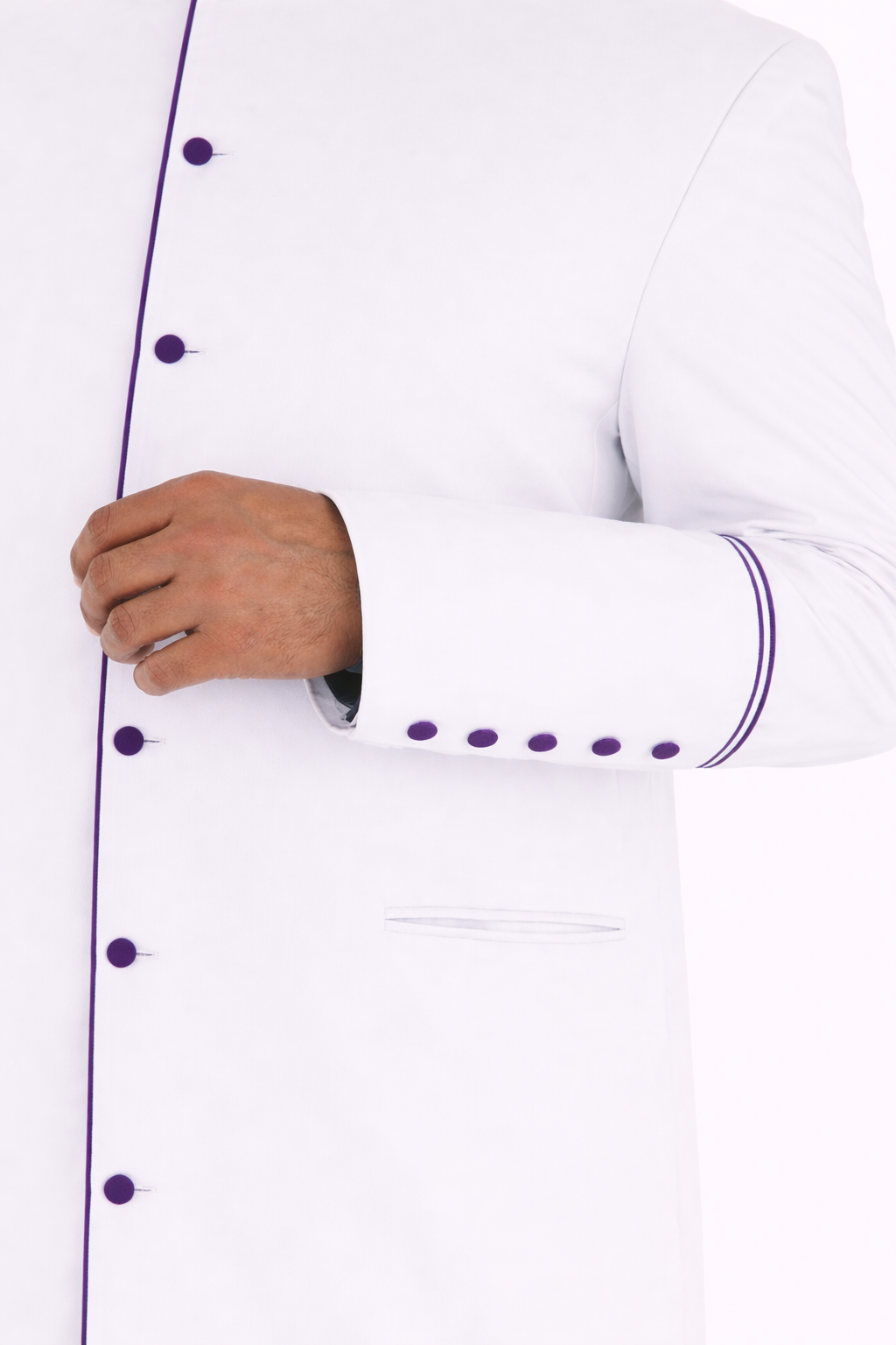 White cassock with purple accents worn by a man