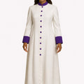Woman wearing a long white robe with purple accents on a white background
