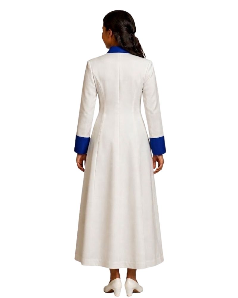 A woman viewed from the back wearing a long white robe with contrasting royal blue trim at the collar and cuffs, paired with white pointed shoes, against a plain white background.
