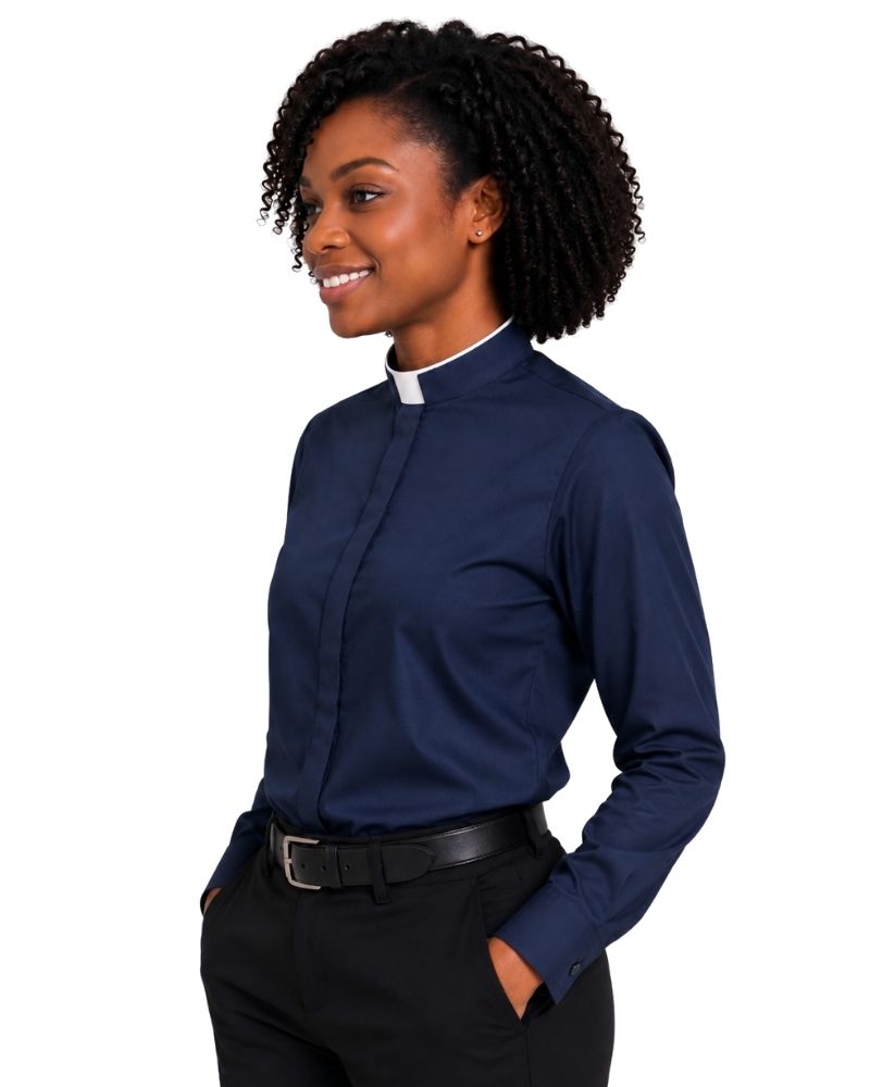 A woman modeling a navy blue long-sleeve clerical shirt with a white collar, paired with black trousers and a black belt, against a plain white background.